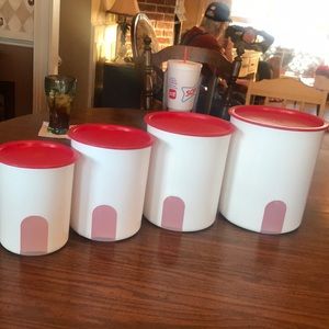 Tupperware red and white canisters in good used condition.